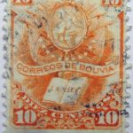 1878 crest and book correos de bolivia la ley 10 diez centavos orange stamp
