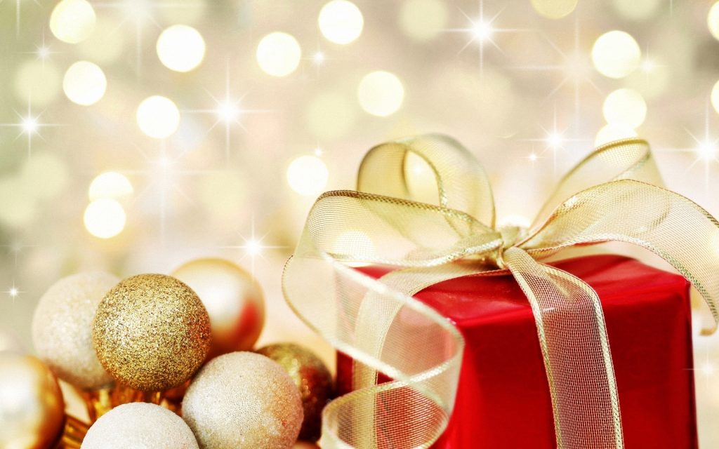 christmas gift on defocused lights background - Wall Paper